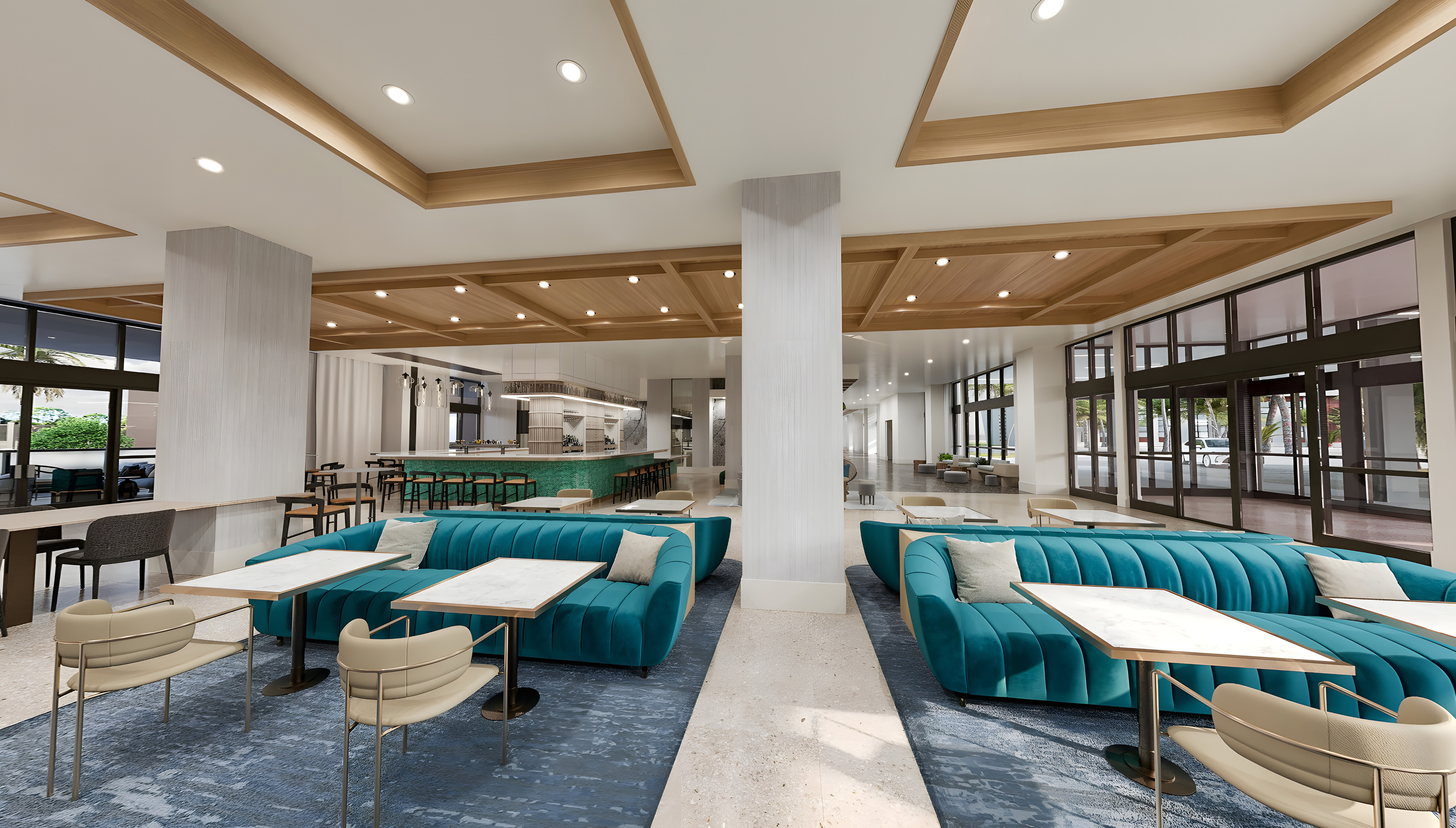 a room with blue couches and tables