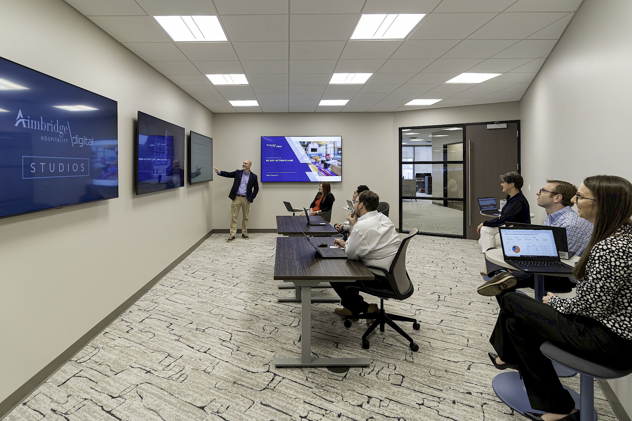a group of people in a room with computers